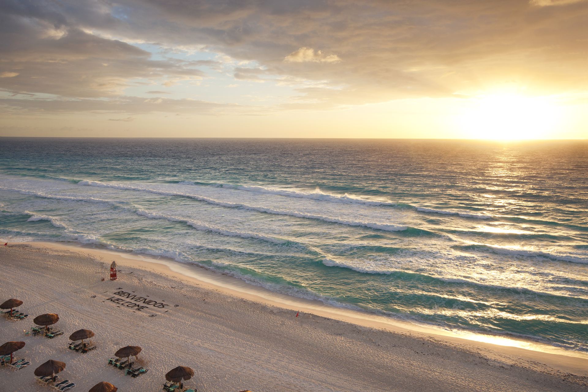 Sunrise over a wide Caribbean beach in Cancún, Mexico