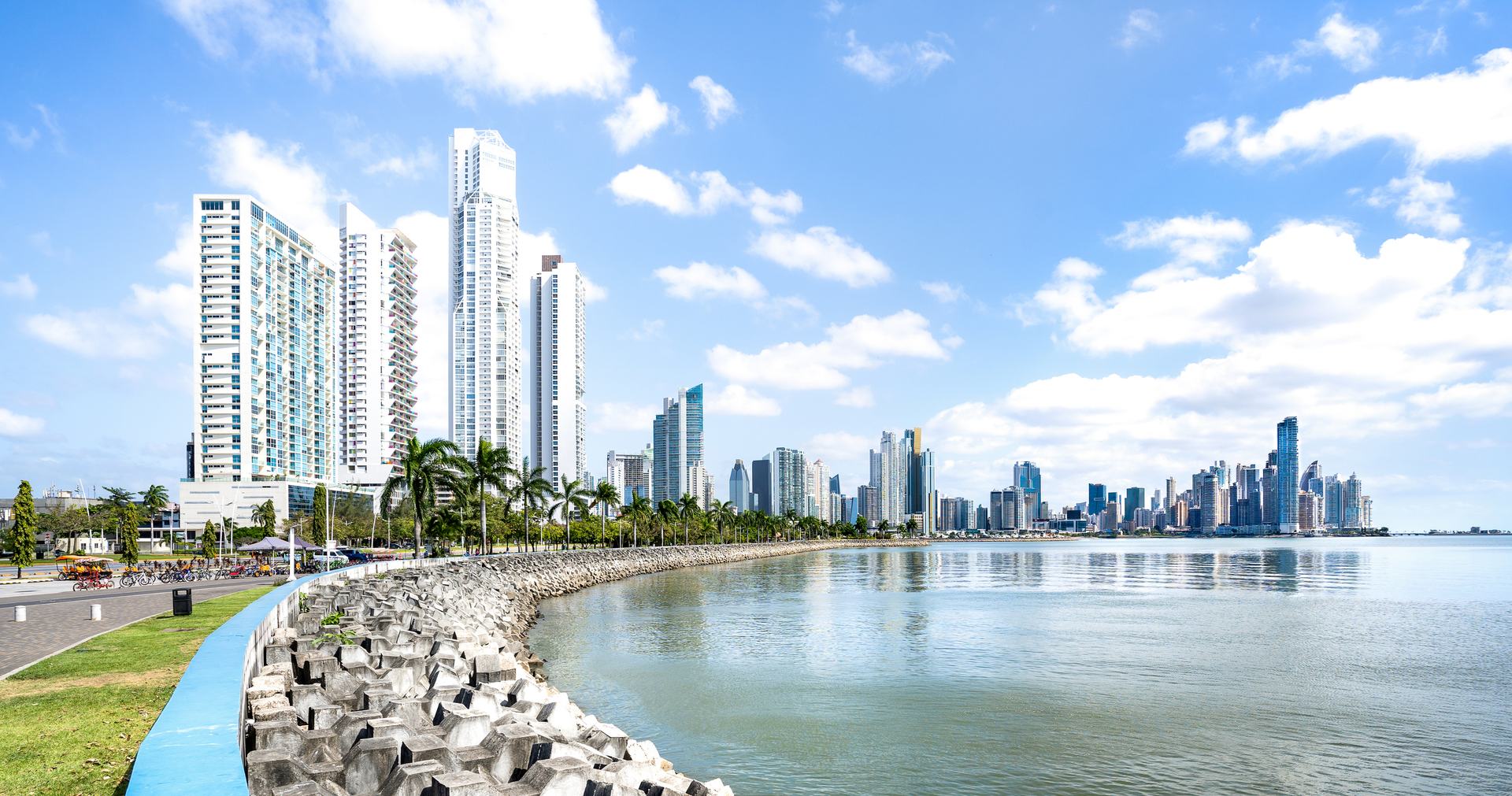 The Panama City skyline and waterfront promenade along the bay on a sunny day